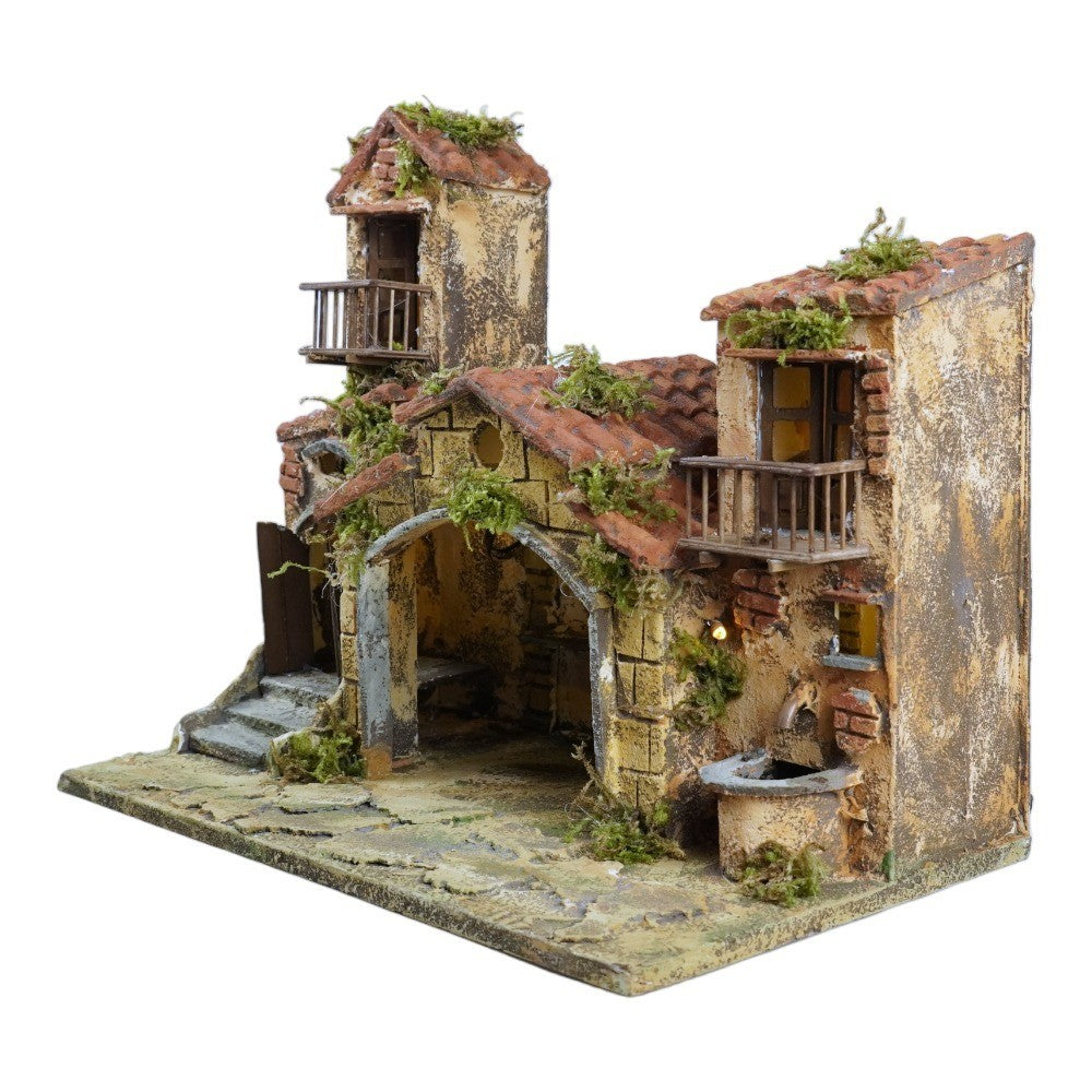 Presepe capanna con case 40x24x32 cm con fontana e luce
